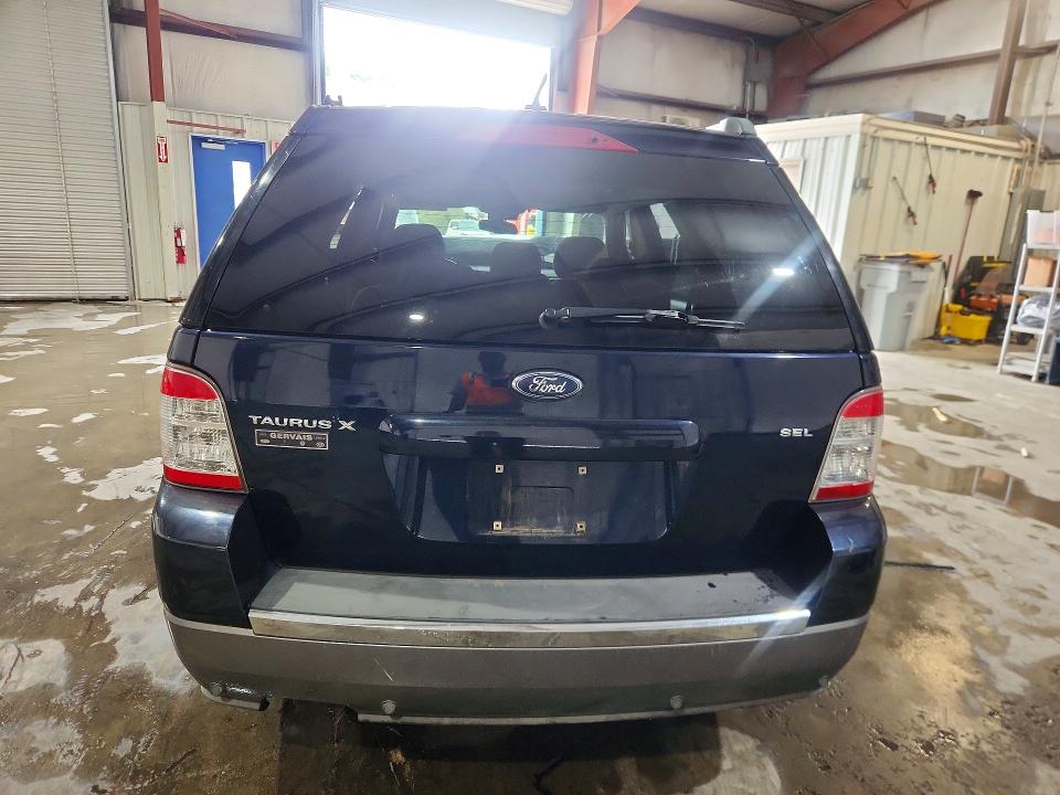 Снимка 6 от търг – 2009 FORD TAURUS X с VIN 1FMDK02W79GA03460