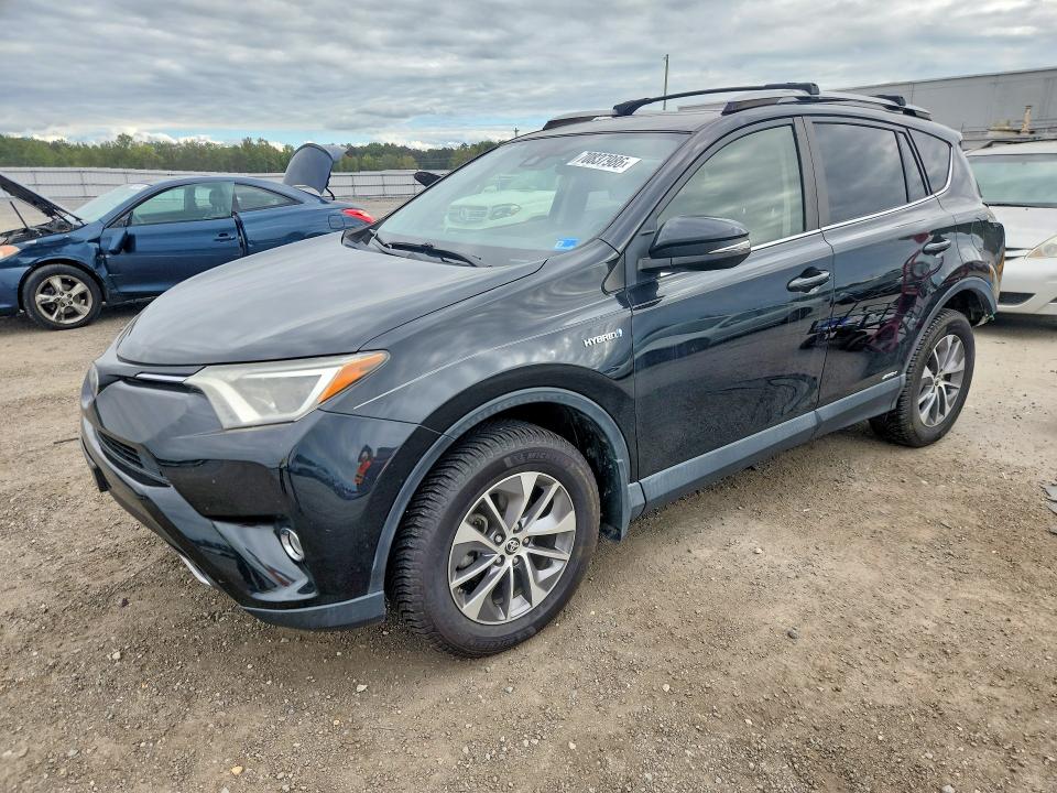 TOYOTA RAV4 HYBRID 2017 с VIN JTMRJREV9HD129999 - Снимка от търг