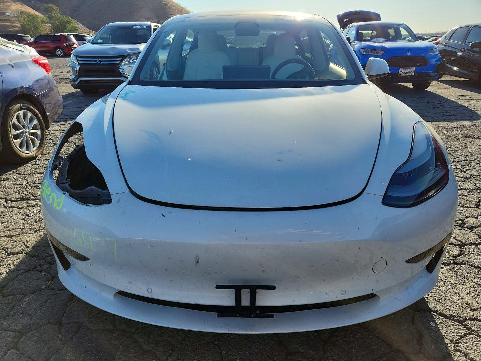 Photo 5 from auction – 2022 TESLA MODEL 3 with VIN 5YJ3E1EC7NF128641