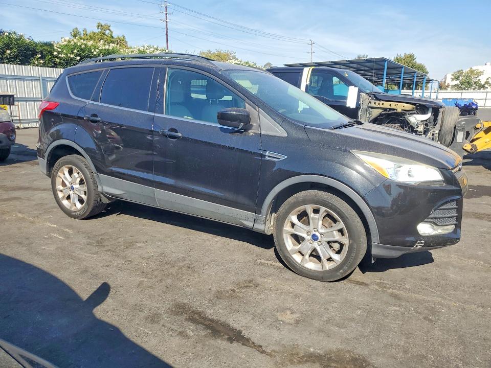 Photo 4 from auction – 2013 FORD ESCAPE with VIN 1FMCU9G90DUD48658