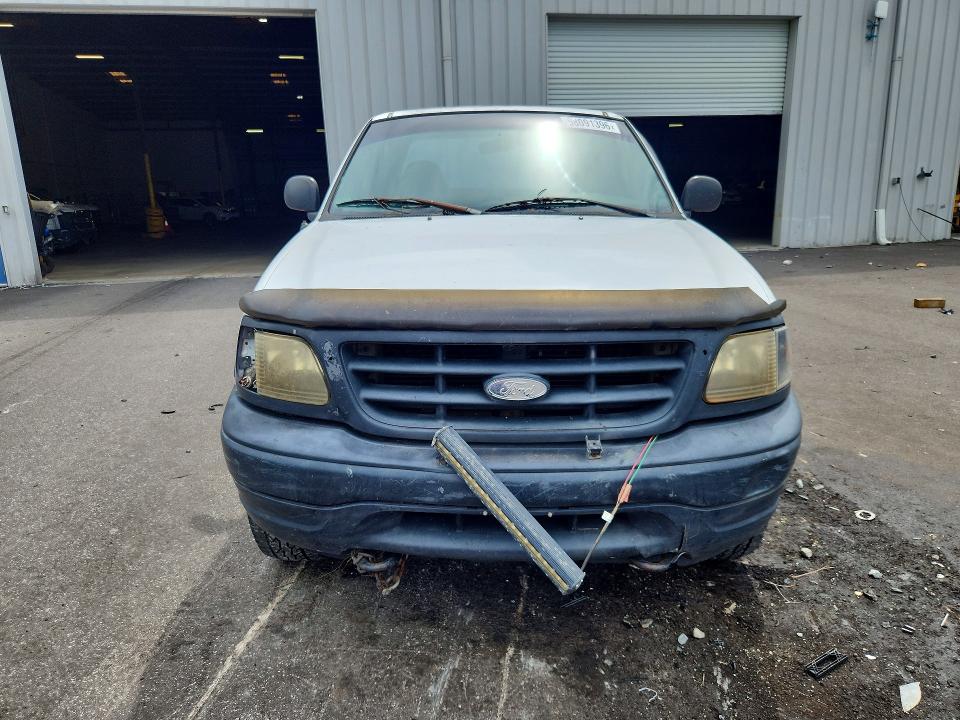 Photo 5 from auction – 2002 FORD F150 with VIN 1FTRX18L32NB05970