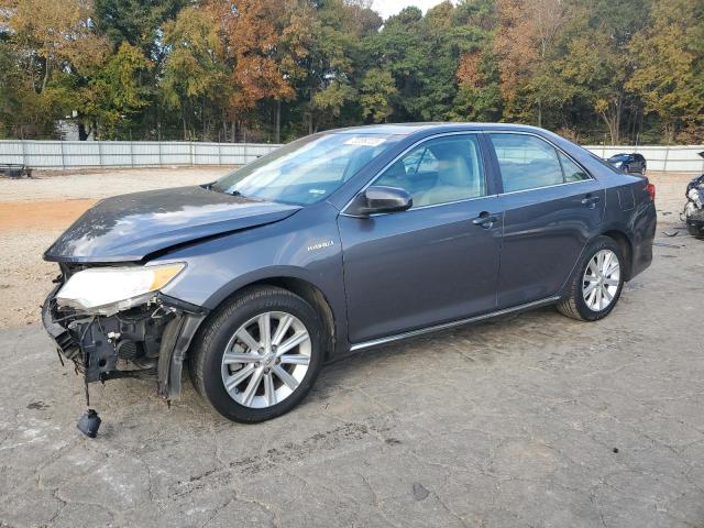 TOYOTA CAMRY HYBR 2014 with VIN 4T1BD1FK8EU097598 - Photo from auction