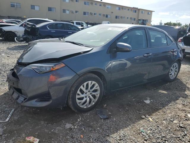 TOYOTA COROLLA L 2019 with VIN 5YFBURHE7KP867051 - Photo from auction