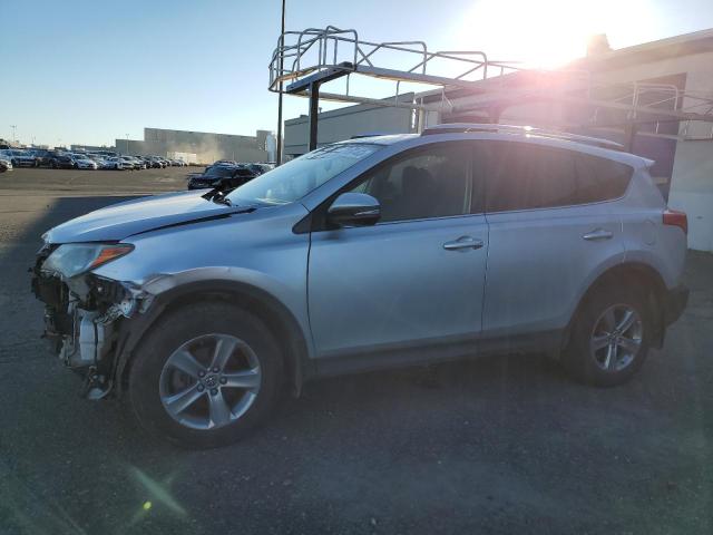 TOYOTA RAV4 XLE 2015 with VIN JTMRFREV9FD098557 - Photo from auction