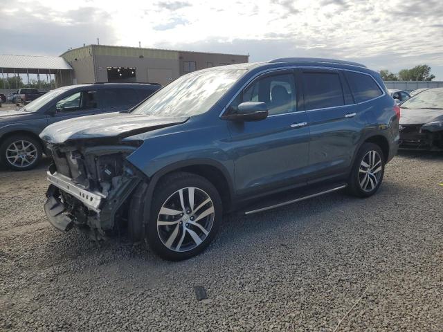 HONDA PILOT TOUR 2018 with VIN 5FNYF6H90JB010537 - Photo from auction