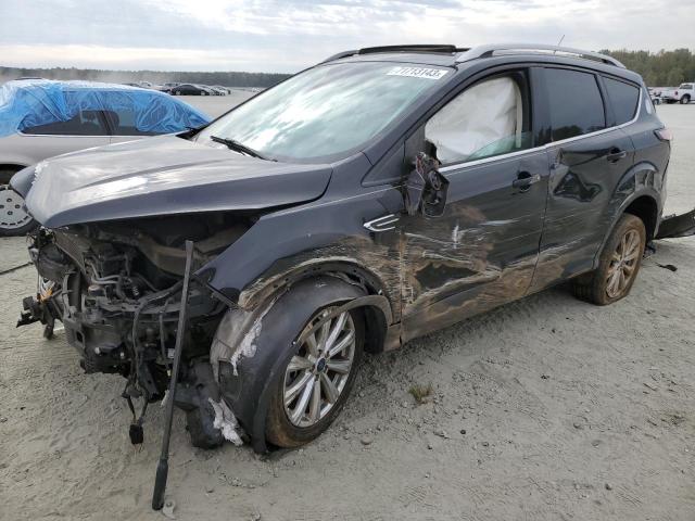 FORD ESCAPE TIT 2017 with VIN 1FMCU0J93HUF02676 - Photo from auction