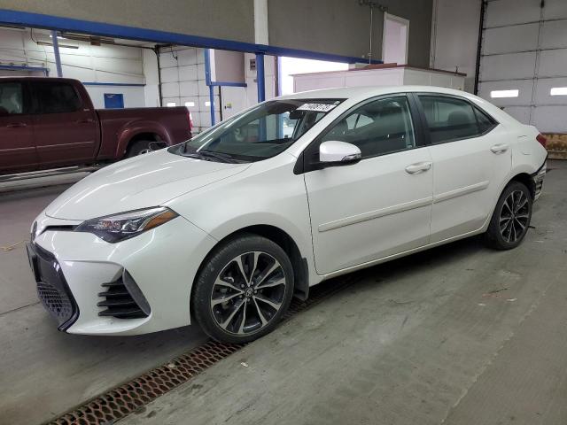 TOYOTA COROLLA L 2018 with VIN 5YFBURHE6JP780045 - Photo from auction