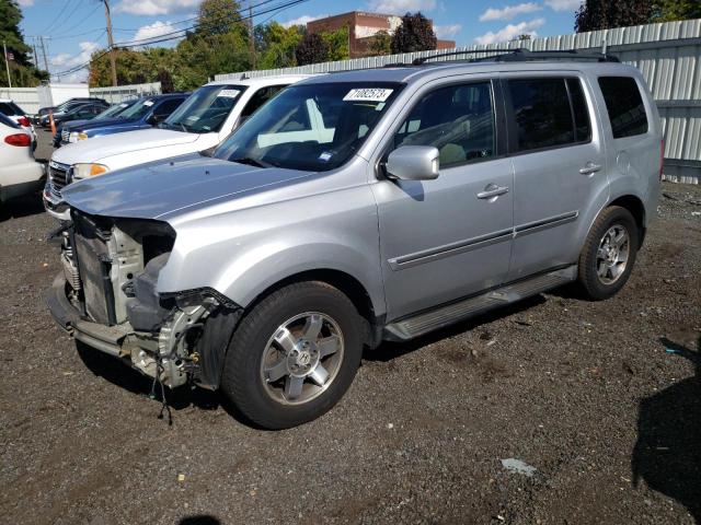 HONDA PILOT TOUR 2011 with VIN 5FNYF4H99BB024703 - Photo from auction