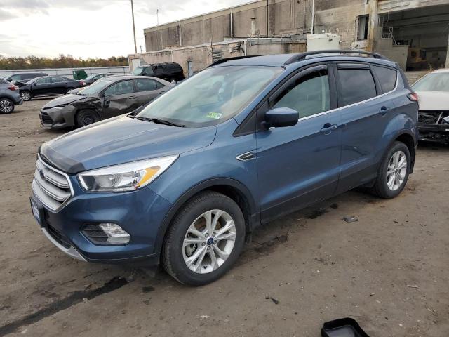 FORD ESCAPE SE 2018 with VIN 1FMCU9GD2JUC17263 - Photo from auction