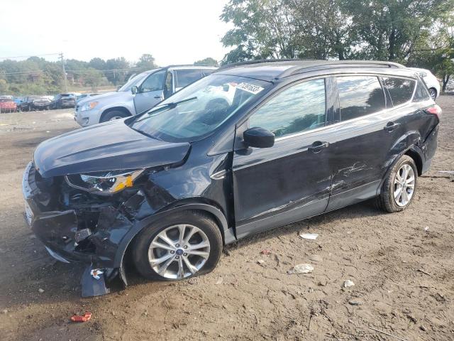 FORD ESCAPE SE 2018 with VIN 1FMCU0GD7JUC77213 - Photo from auction