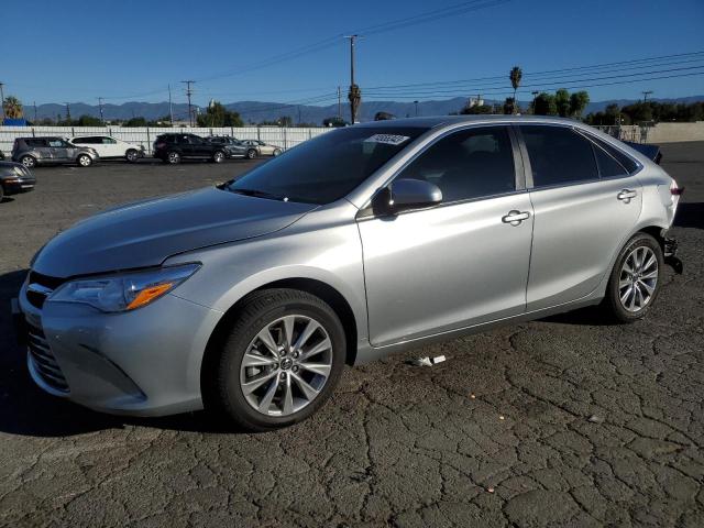 TOYOTA CAMRY LE 2017 with VIN 4T1BF1FK7HU665841 - Photo from auction