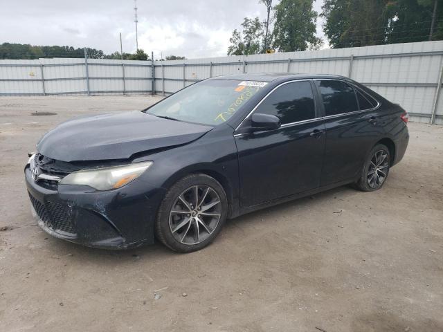 TOYOTA CAMRY LE 2015 with VIN 4T1BF1FKXFU006990 - Photo from auction