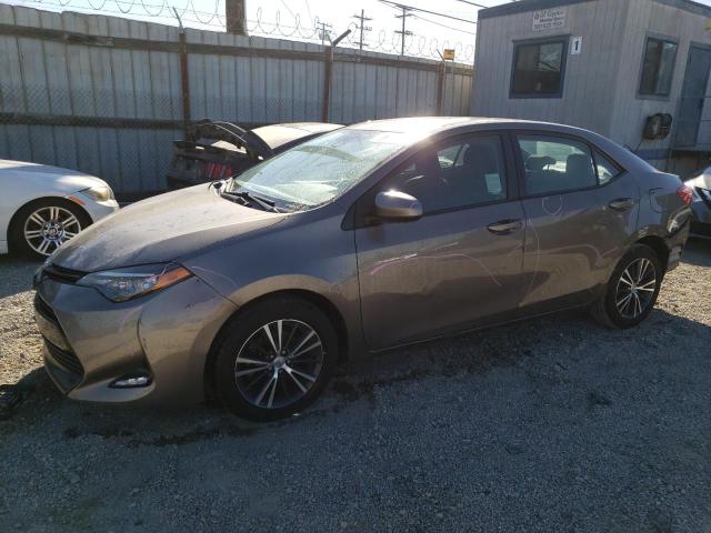 TOYOTA COROLLA L 2017 with VIN 5YFBURHE9HP663599 - Photo from auction