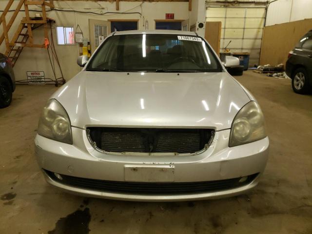 Photo 5 from auction – 2007 KIA OPTIMA LX with VIN KNAGE124975129595