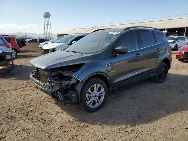 FORD ESCAPE SE 2018 with VIN 1FMCU9GD6JUB17604 - Photo from auction