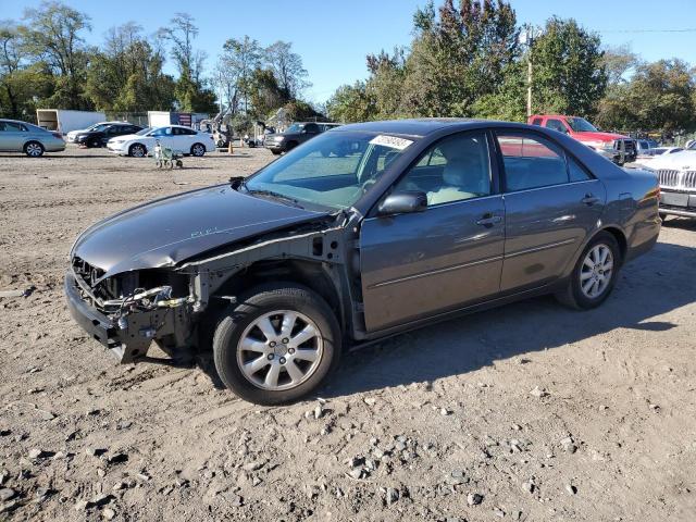 TOYOTA CAMRY LE 2003 with VIN 4T1BF30KX3U556898 - Photo from auction
