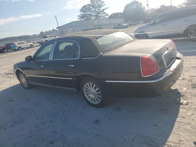 Photo 2 from auction – 2004 LINCOLN TOWN CAR E with VIN 1LNHM81W64Y688534
