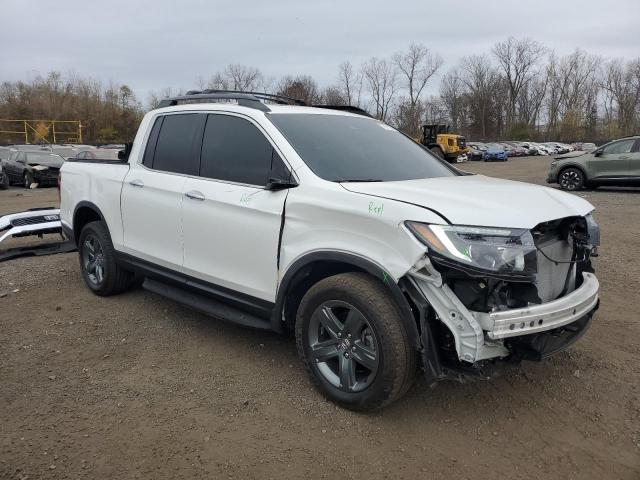 Photo 4 from auction – 2023 HONDA RIDGELINE with VIN 5FPYK3F75PB012599