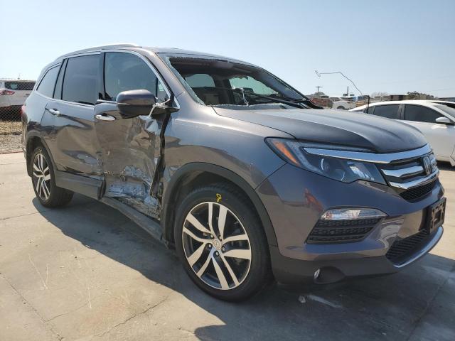 Photo 4 from auction – 2018 HONDA PILOT TOUR with VIN 5FNYF5H91JB001940