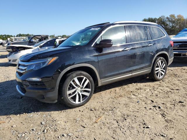 HONDA PILOT ELIT 2018 with VIN 5FNYF6H02JB023310 - Photo from auction