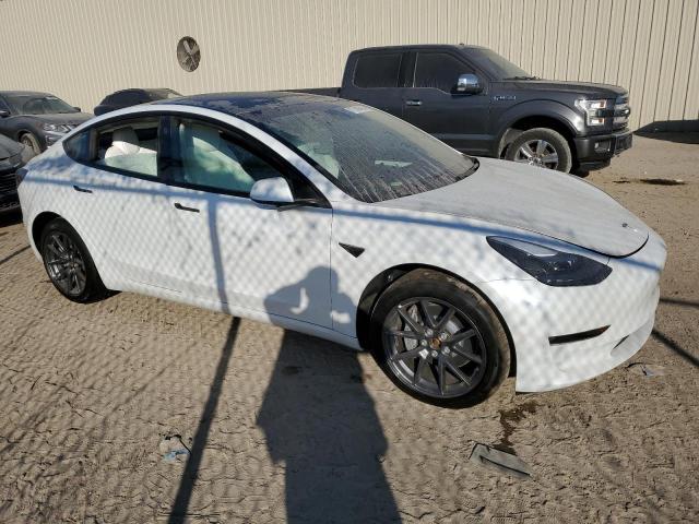 Photo 4 from auction – 2021 TESLA MODEL 3 with VIN 5YJ3E1EB9MF035738