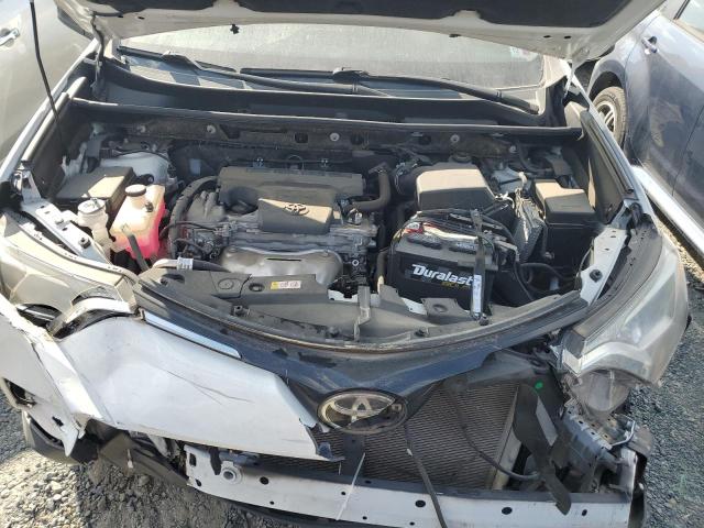 Photo 12 from auction – 2018 TOYOTA RAV4 LE with VIN JTMZFREV0JJ212293