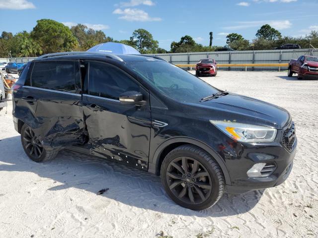 Photo 4 from auction – 2017 FORD ESCAPE TIT with VIN 1FMCU9JD4HUC08549