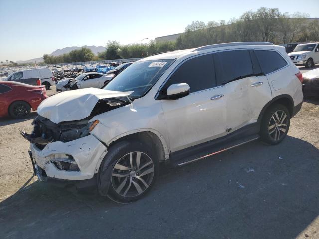 HONDA PILOT TOUR 2017 with VIN 5FNYF6H92HB092491 - Photo from auction