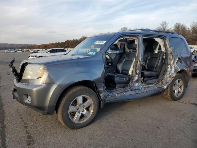 HONDA PILOT EXL 2011 with VIN 5FNYF4H67BB066180 - Photo from auction