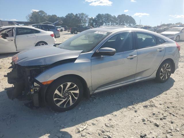 HONDA CIVIC EX 2017 with VIN 19XFC2F74HE042093 - Photo from auction