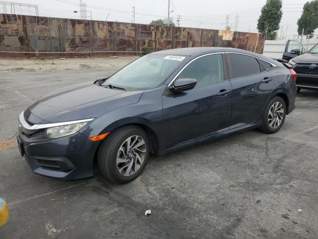 HONDA CIVIC EX 2018 with VIN 2HGFC2F71JH571674 - Photo from auction
