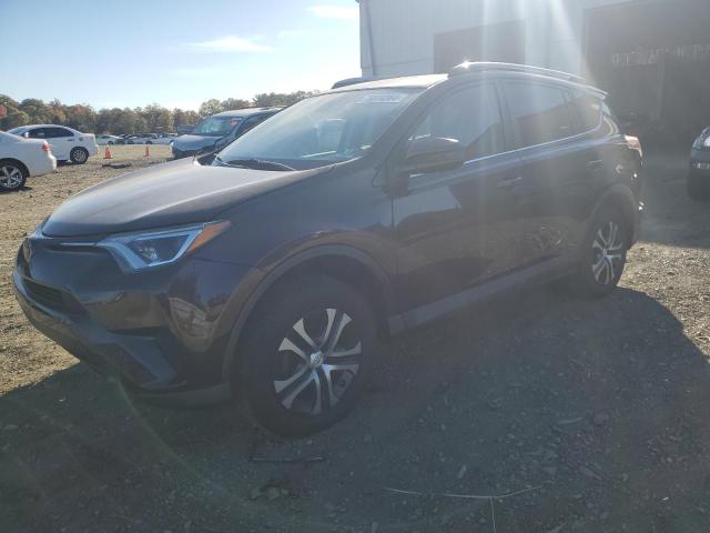 TOYOTA RAV4 LE 2018 with VIN 2T3BFREV8JW852285 - Photo from auction