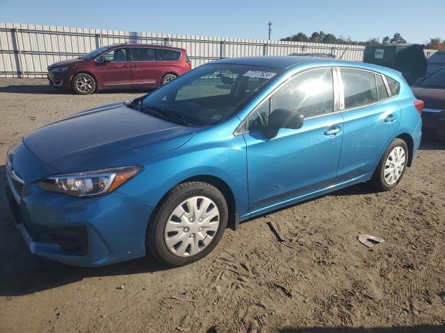 SUBARU IMPREZA 2018 with VIN 4S3GTAA67J3715498 - Photo from auction