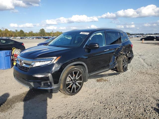 HONDA PILOT TOUR 2020 with VIN 5FNYF6H99LB046259 - Photo from auction