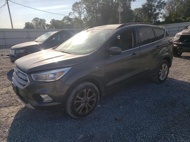 FORD ESCAPE SE 2018 with VIN 1FMCU9GD0JUC25023 - Photo from auction