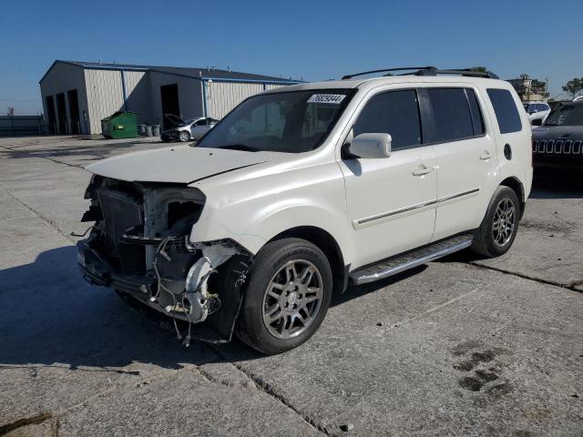 HONDA PILOT TOUR 2014 with VIN 5FNYF4H98EB003166 - Photo from auction