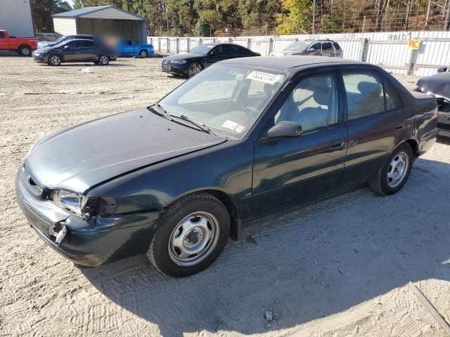 TOYOTA COROLLA VE 1999 with VIN 2T1BR12E2XC159938 - Photo from auction