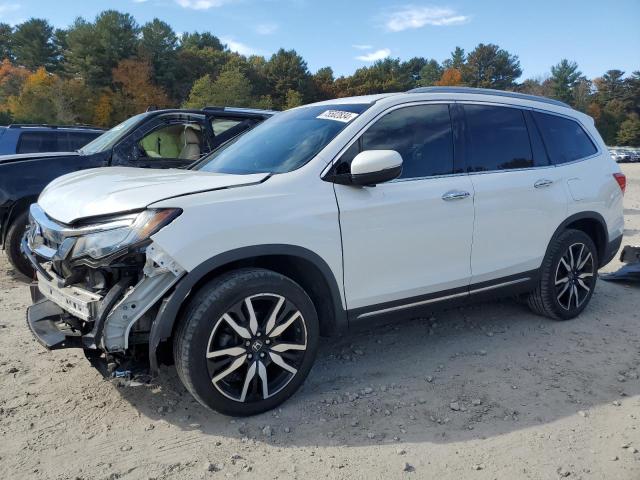 HONDA PILOT TOUR 2020 with VIN 5FNYF6H69LB017334 - Photo from auction