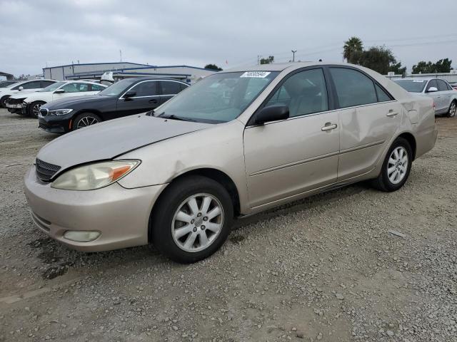 TOYOTA CAMRY LE 2004 with VIN 4T1BF32KX4U577412 - Photo from auction