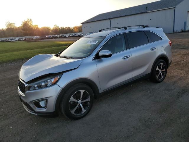 KIA SORENTO EX 2016 with VIN 5XYPHDA59GG097857 - Photo from auction