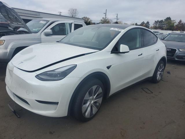 TESLA MODEL Y 2024 with VIN 7SAYGAEE3RF060557 - Photo from auction