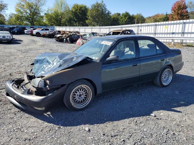 TOYOTA COROLLA VE 1999 with VIN 2T1BR12E2XC215618 - Photo from auction