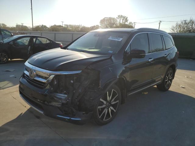 HONDA PILOT TOUR 2019 with VIN 5FNYF5H69KB031002 - Photo from auction