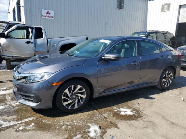 HONDA CIVIC EX 2018 with VIN 19XFC2F79JE202667 - Photo from auction