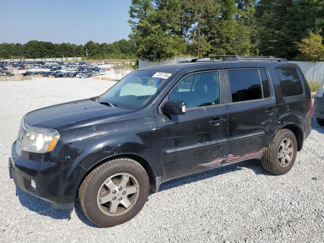 HONDA PILOT TOUR 2011 with VIN 5FNYF4H9XBB090502 - Photo from auction