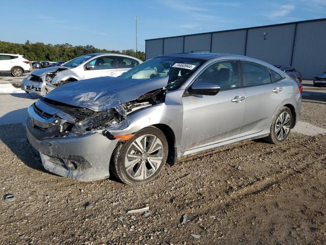 HONDA CIVIC EXL 2018 with VIN JHMFC1F79JX005779 - Photo from auction