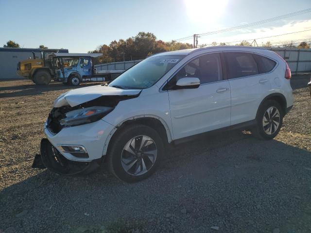 HONDA CR-V TOURI 2015 with VIN 5J6RM4H91FL077080 - Photo from auction