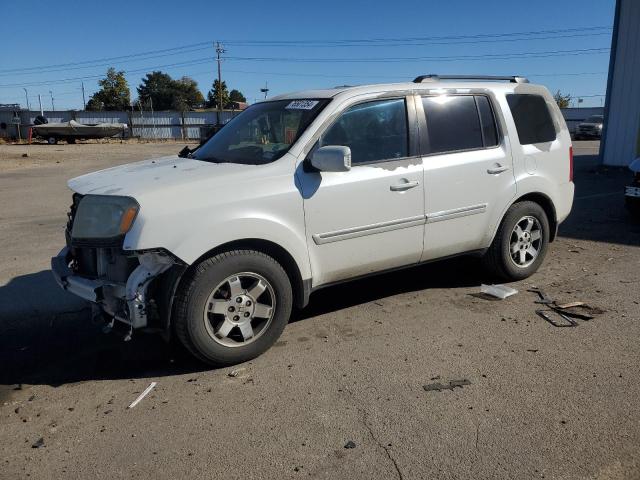 HONDA PILOT TOUR 2011 with VIN 5FNYF4H94BB066499 - Photo from auction