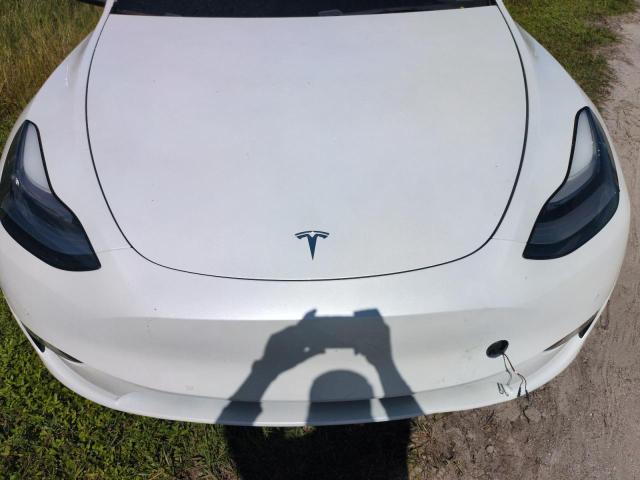 Photo 12 from auction – 2021 TESLA MODEL Y with VIN 5YJYGDEE9MF074647