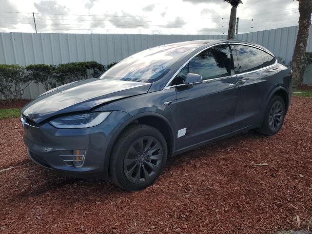 TESLA MODEL X 2018 with VIN 5YJXCBE2XJF102355 - Photo from auction